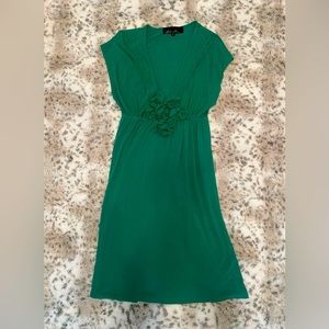 Emerald green dress, deep v-neck with lovely pleating and fabric flower detail